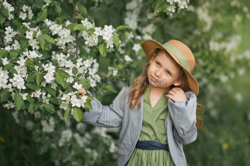 child girl in country style plaid shirt and hat