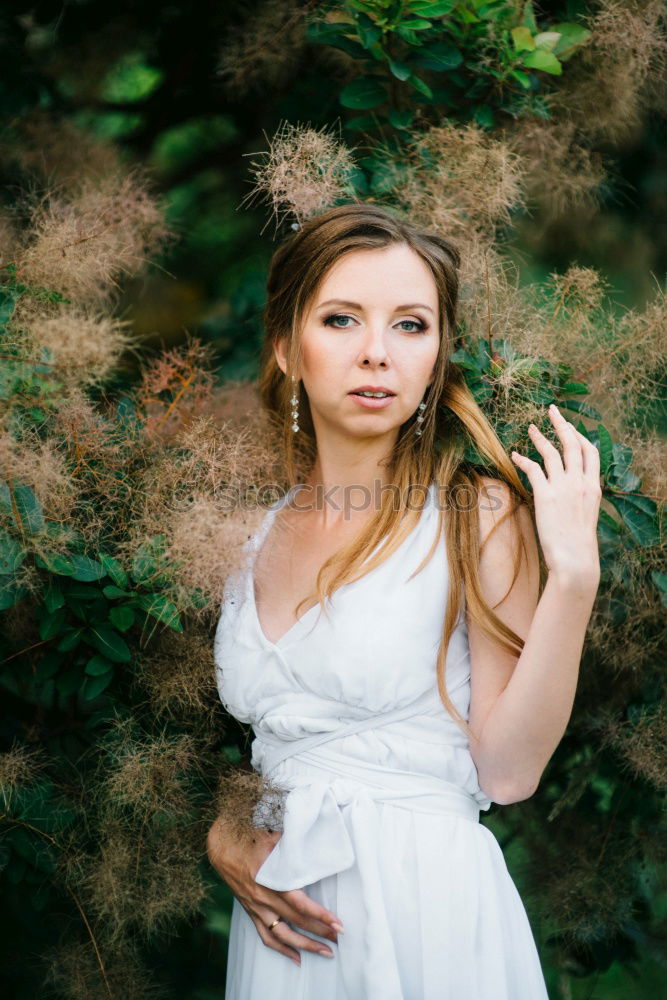 Similar – A Young Woman Standing in the Woods