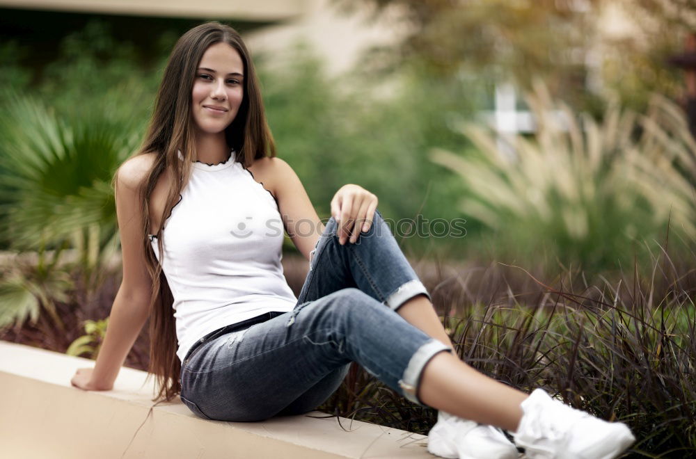 Image, Stock Photo African woman with black curly hairstyle sitting on urban floor.