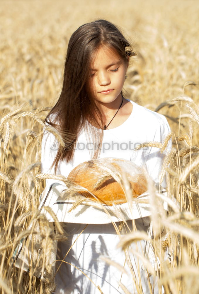 Image, Stock Photo lonely, pensive teenager sits in a field