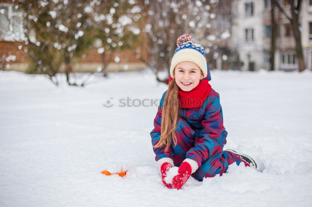 Similar – baby girl in knitted hat walking in winter forest