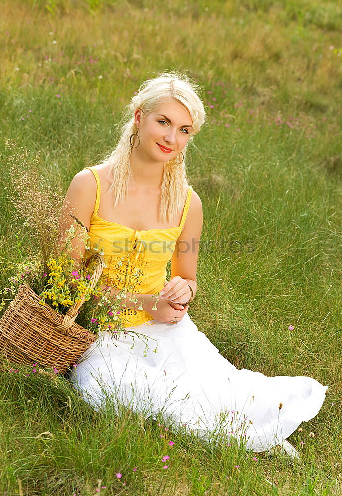 Similar – analogue portrait of a young woman sitting barefoot in a rye field in a summer dress and smiling