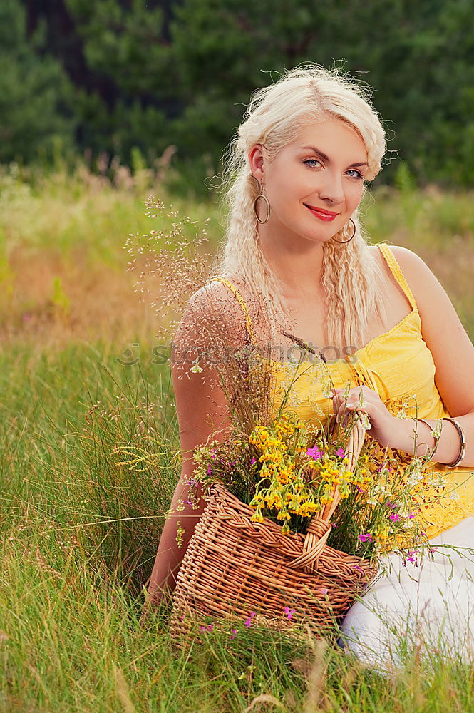 Similar – analogue portrait of a young woman sitting barefoot in a rye field in a summer dress and smiling