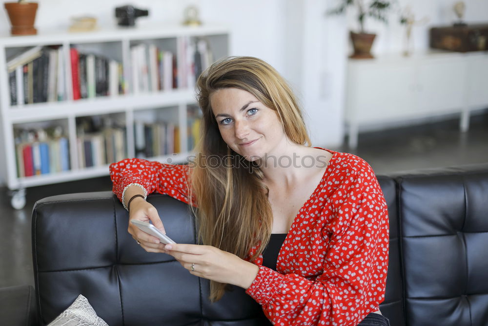 Similar – Image, Stock Photo Smiling woman sitting on a sofa at home using a laptop