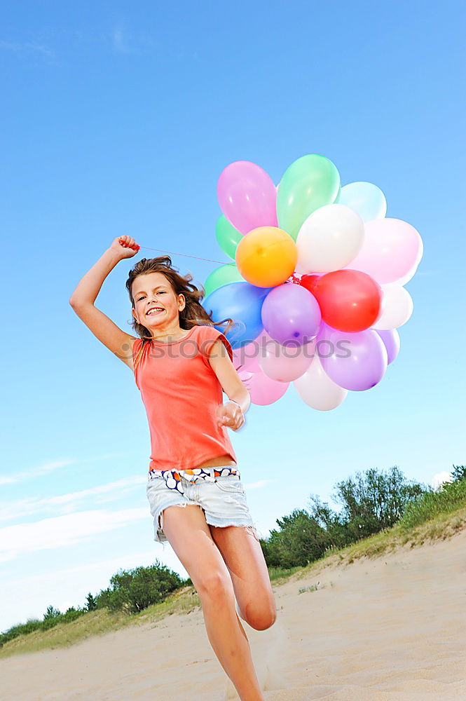 Similar – Image, Stock Photo Little girl with balloons standing on the beach