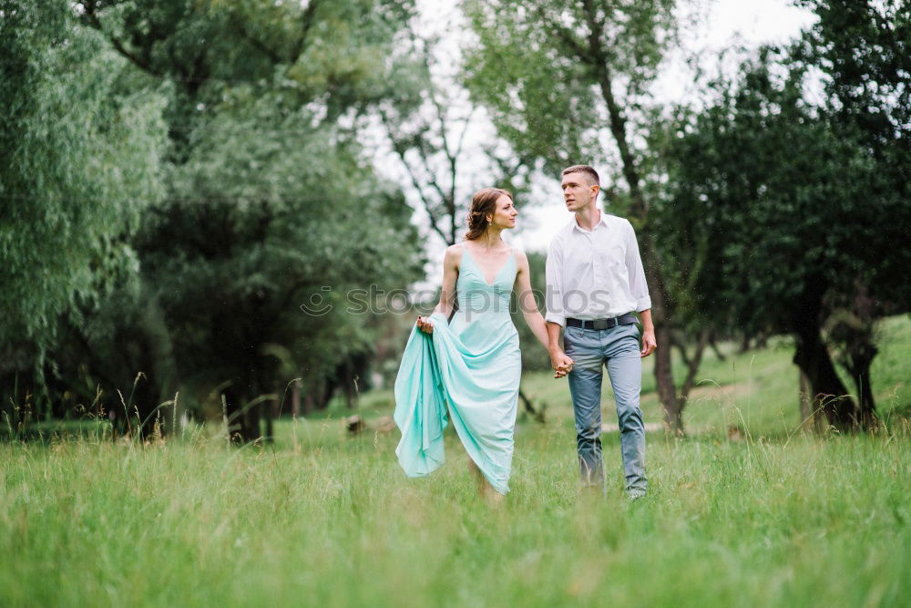 Similar – Image, Stock Photo Young adult adventerous couple hitchhiking together