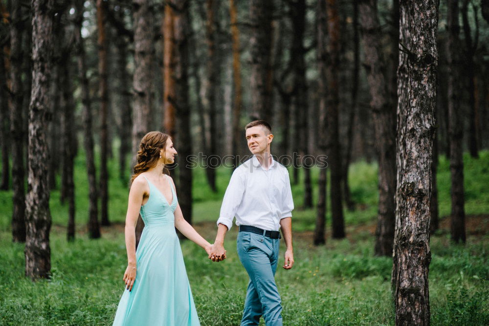 Similar – Image, Stock Photo young couple with dog is in the woods, the woman is pregnant