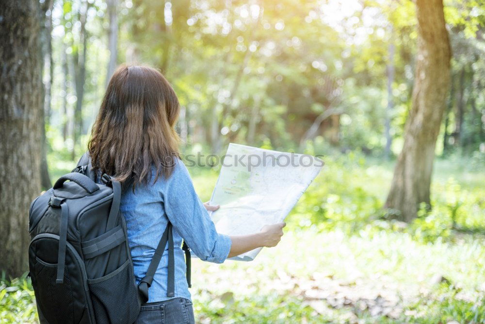 Similar – Image, Stock Photo Man navigating on road in woods