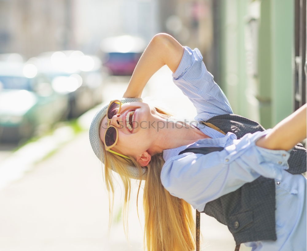 Similar – Happy friends sitting on steps