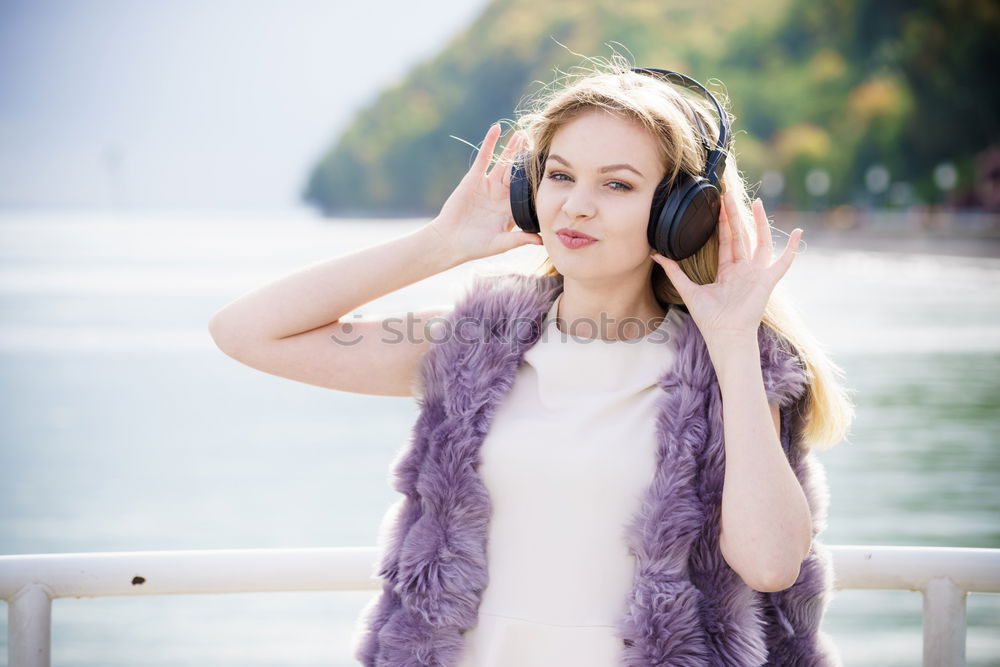 Similar – Image, Stock Photo Young girl with headphones standing on the street