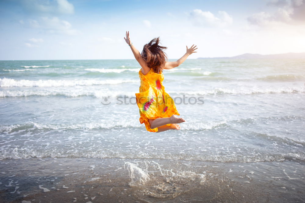 Similar – Image, Stock Photo woman with long pink dress on a tropical beach