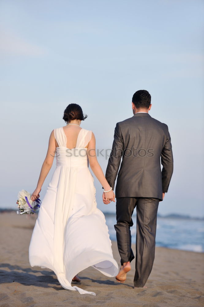 Similar – Image, Stock Photo Beautiful bridal couple posing on shore