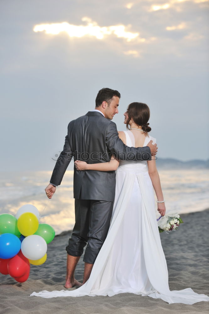 Similar – Image, Stock Photo Tender kissing bridal couple in sunlight