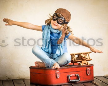 Similar – Boy with suitcase on the road