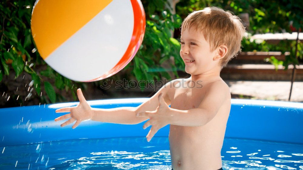 Similar – One little happy boy playing on the inflatable circle in swimming pool at the day time. Concept of friendly family.