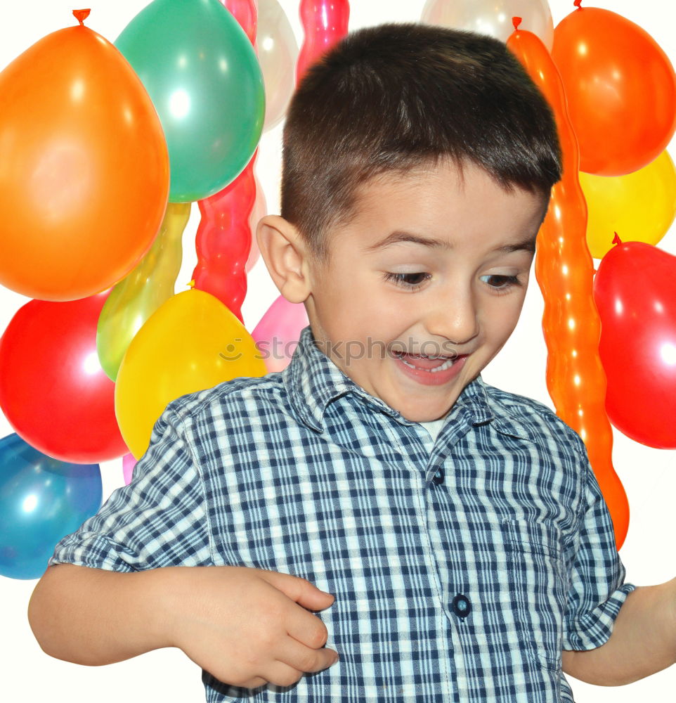 happy and smiling boy with colorful balloons