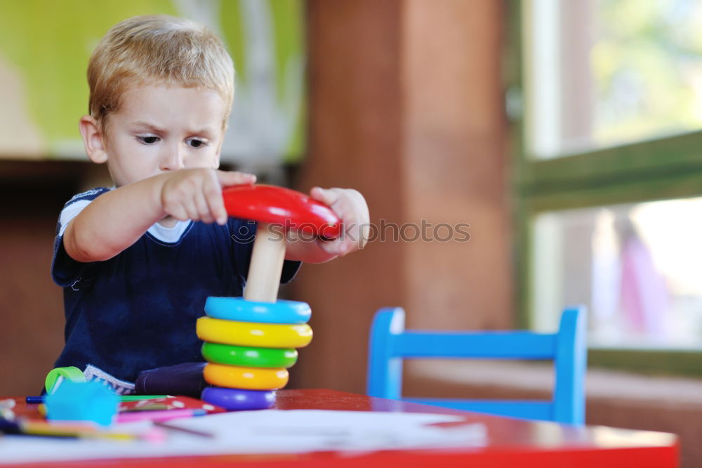 Similar – Image, Stock Photo Happy baby playing with toy blocks.