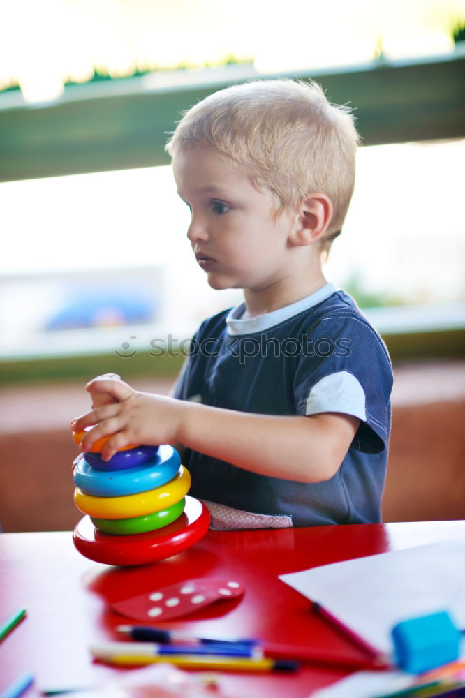 Similar – Happy baby playing with toy blocks.