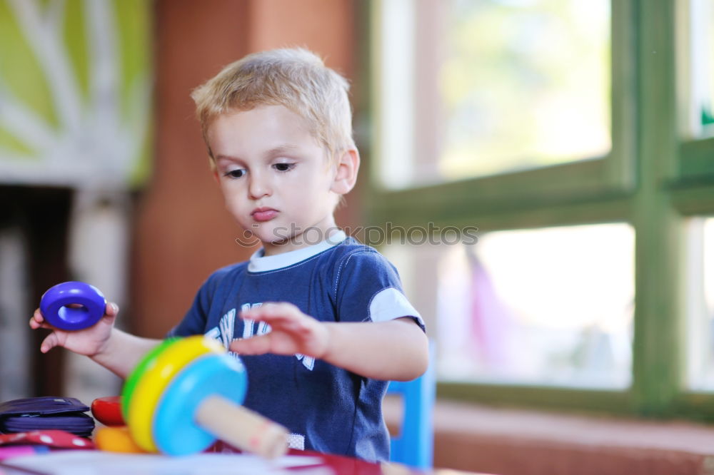 Similar – Image, Stock Photo Happy baby playing with toy blocks.