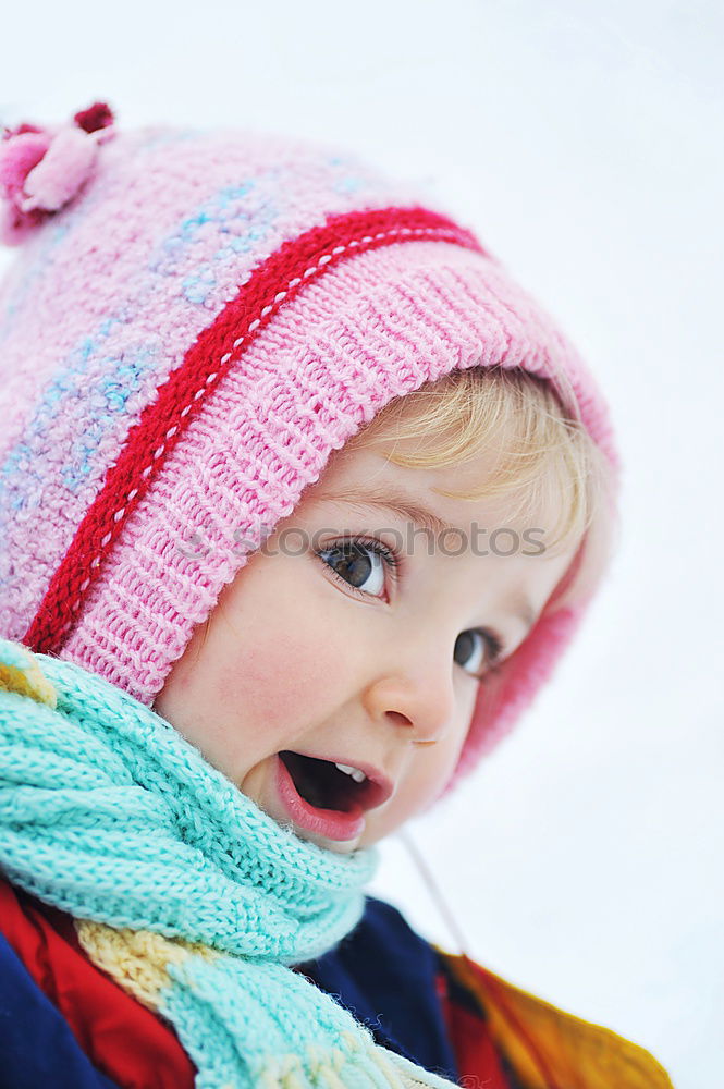 Similar – cute baby girl in knitted scarf walking in winter