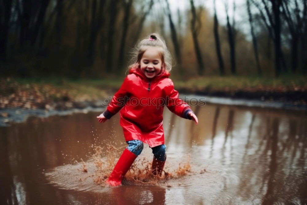 Similar – Rubber boots in the mud