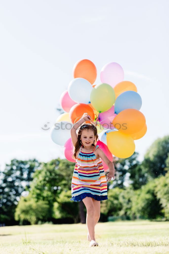 Similar – Cute black boy having fun on a swing in his parents garden