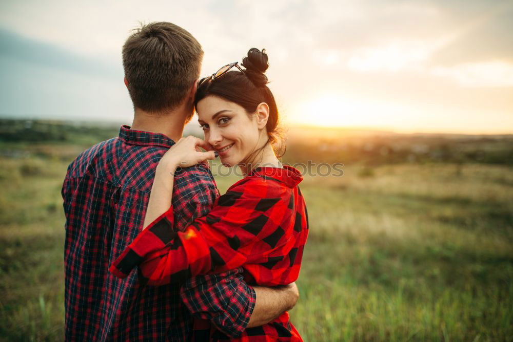 Similar – Close up of bearded man and blonde woman hugging outdoors