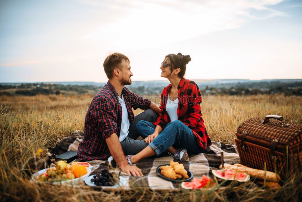 Similar – Couple eating pizza at date night in sunset