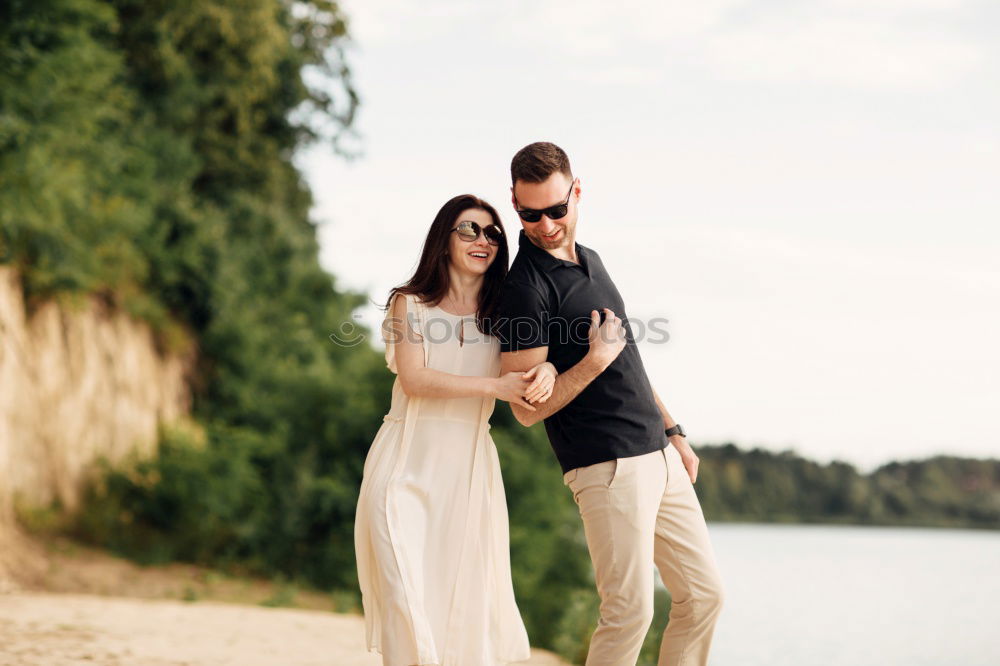 Similar – Image, Stock Photo Cheerful couple posing on nature