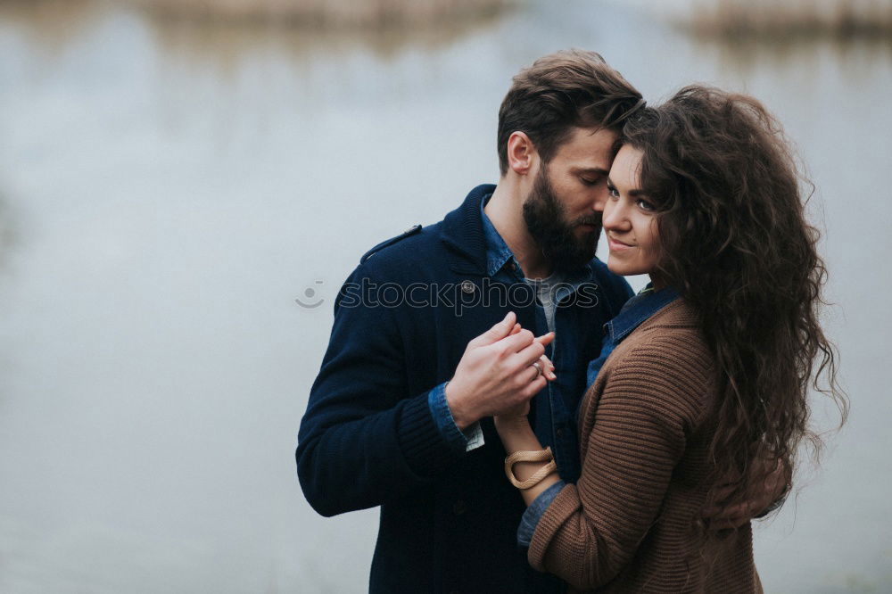 Similar – Blonde girl looks at camera while embraces her bearded boyfriend.