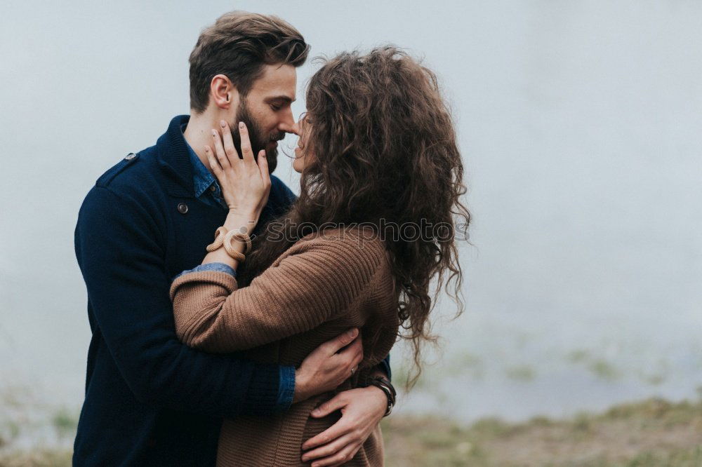 Similar – Blonde girl looks at camera while embraces her bearded boyfriend.