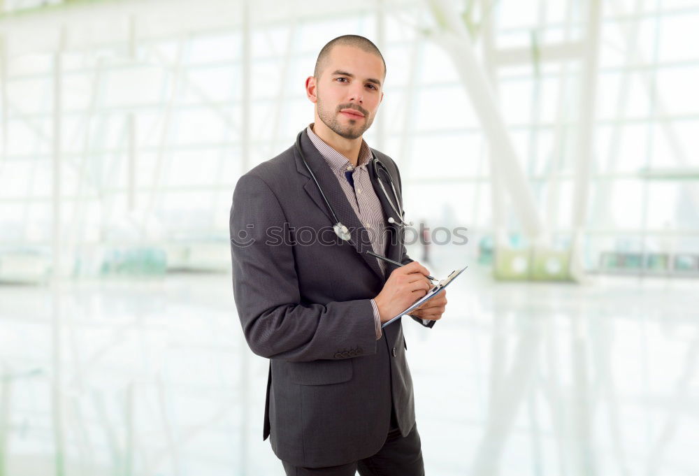 Image, Stock Photo man sitting at the airport using laptop and mobile phone next to the window