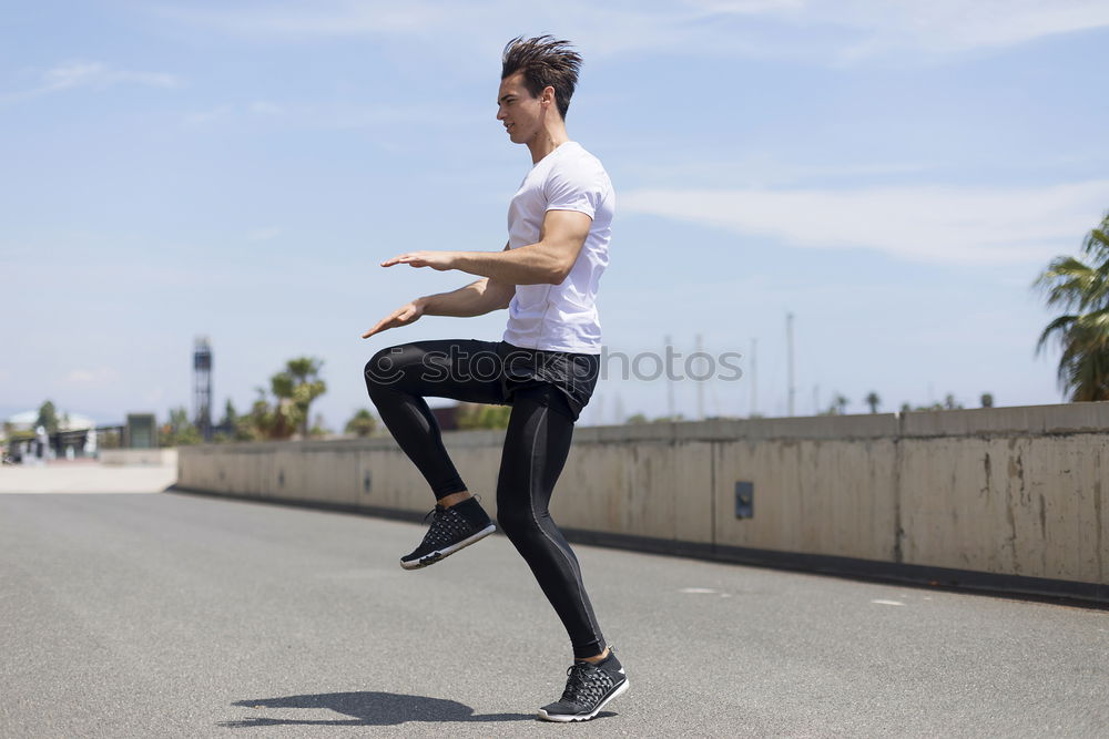 Similar – Muscular man stretching outdoors