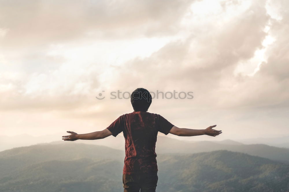 Image, Stock Photo A women with a bottle in her hand looks at the landscape