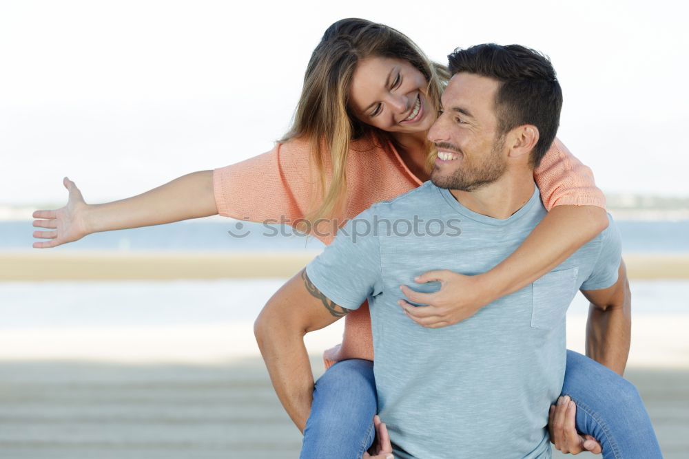 Similar – Cheerful couple having fun