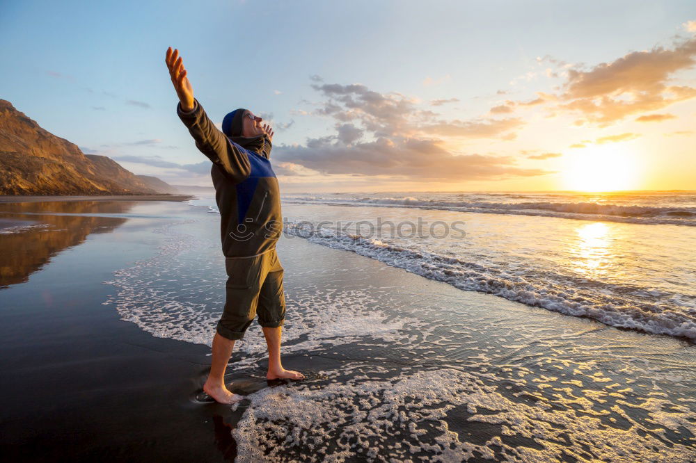 Similar – Athletic man balancing on gymnastic rings