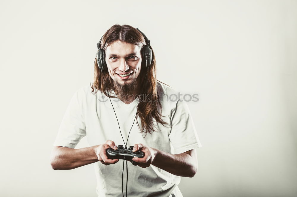 Similar – Portrait of relaxed young boy sitting at the patio door and listening to music from mobile phone