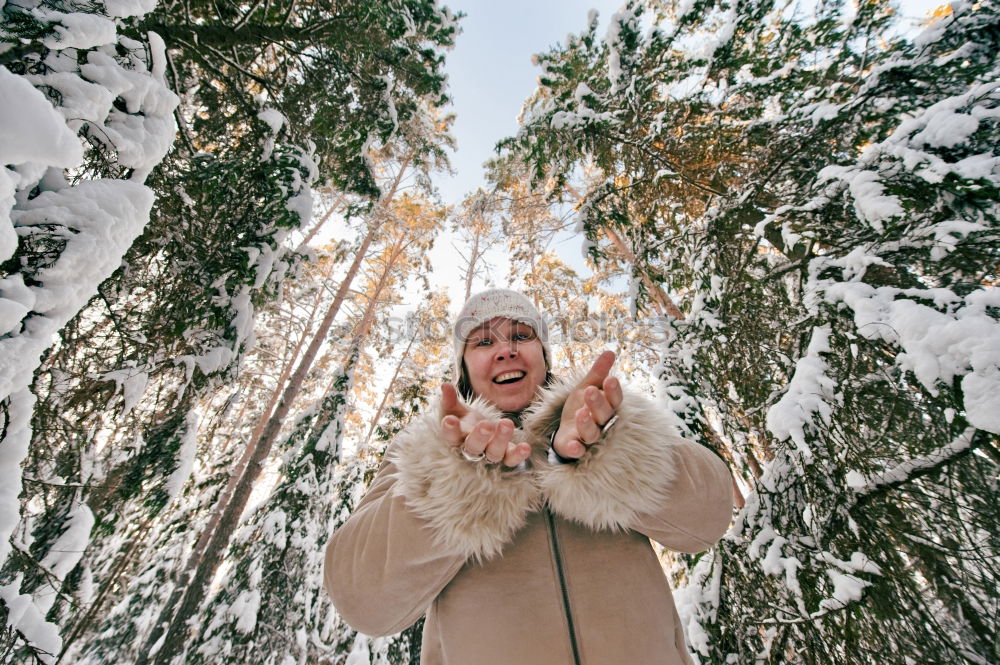 Similar – Image, Stock Photo portrait Young pretty woman enjoying and playing with snow in winter