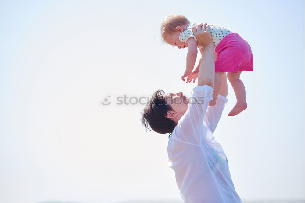 Similar – Father and son playing on the beach at the day time. Concept of friendly family.