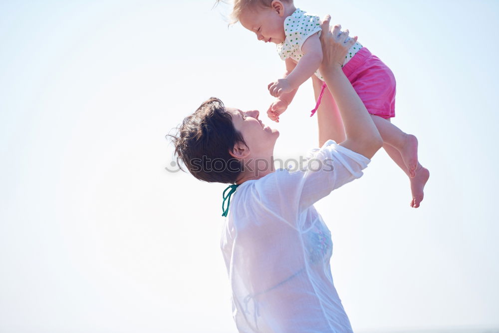 Similar – Father and son playing on the beach at the day time. Concept of friendly family.