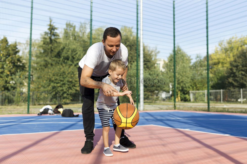 Similar – Image, Stock Photo Dad and little son playing basketball