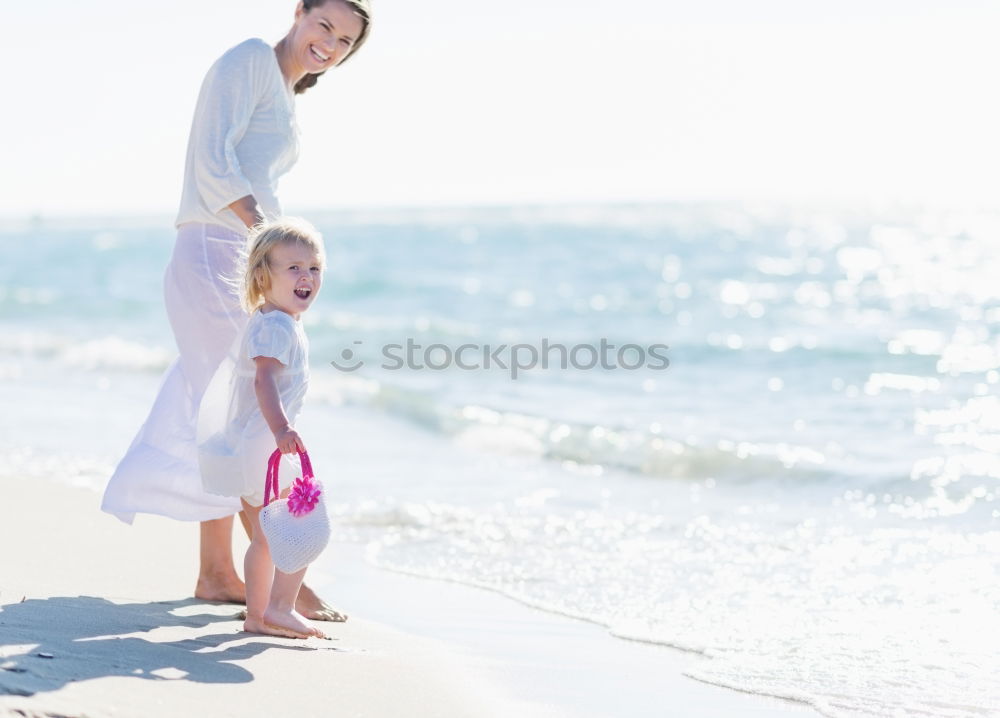 Similar – Father and children playing on the beach at the day time. Concept of friendly family.