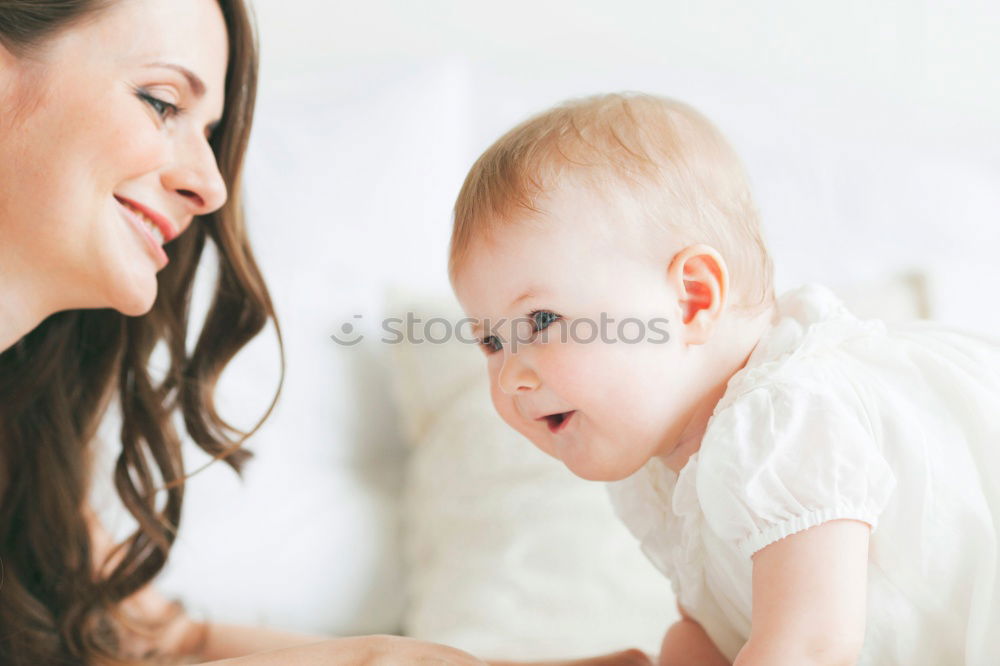 Similar – Image, Stock Photo Portrait of a mother with her baby at home.