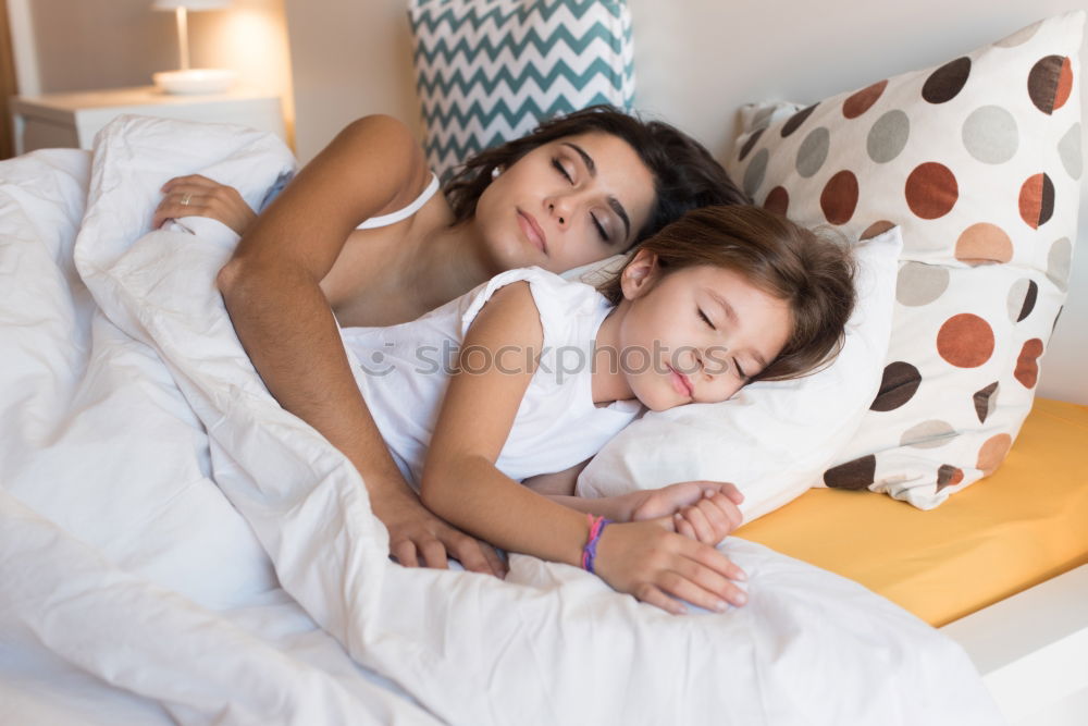 Similar – Image, Stock Photo mother and child son sleeping together in bed