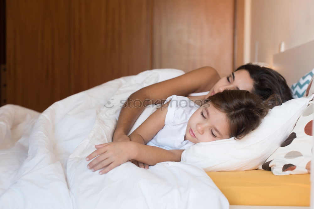 Similar – Brother and sister tickling and laughing on bed