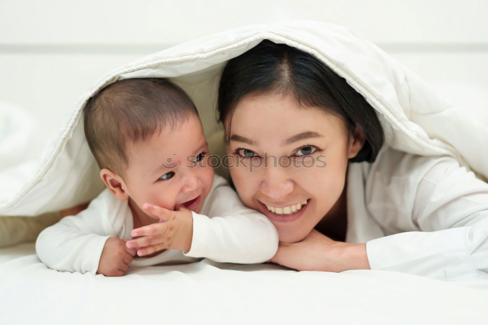Similar – Image, Stock Photo Baby girl two months old smiling to her mother at home