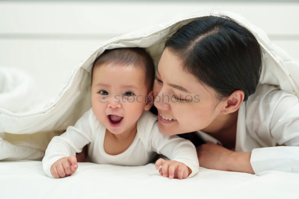 Similar – Image, Stock Photo Baby girl two months old smiling to her mother at home