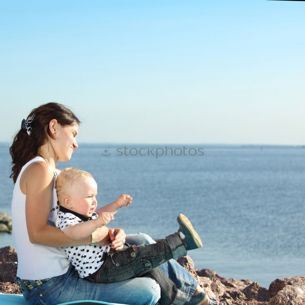 Similar – Image, Stock Photo Mother and son pointing a place near the sea