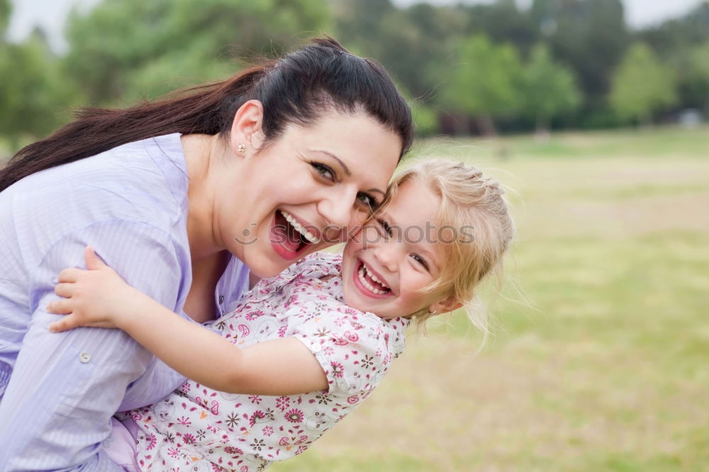 Similar – Happy mother and daughter playing in the park at the day time. Concept of celebration Mothers day .