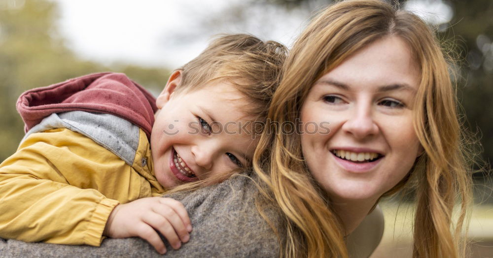 Similar – Image, Stock Photo A mother hugs her young son on the way to school, and a mother and boy say goodbye before school. Concept of education and training, return to school